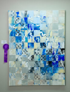 Abstract mosaic art with blue and gray tones, awarded a purple ribbon.