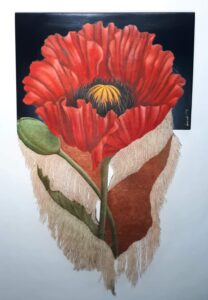 A vibrant red flower with detailed petals and textured leaves.