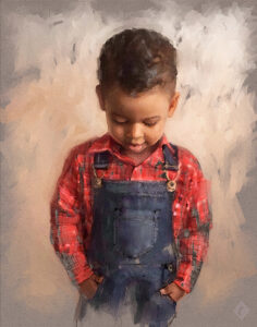 A young boy in red and blue looks down thoughtfully.