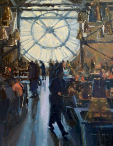 People inside a building with a large clock face window.