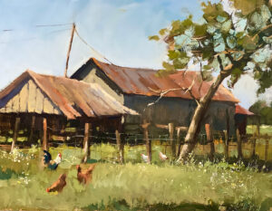 Rustic farm buildings with chickens roaming the yard under a tree.