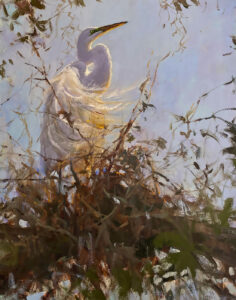 A graceful white bird perched among branches under a soft sky.