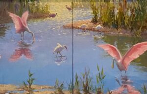 A serene lake scene with flamingos and other birds at sunset.