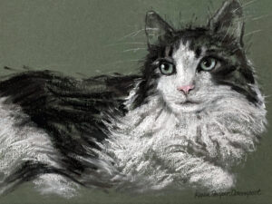 A fluffy cat with green eyes lying down on a textured green surface.