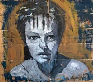 A striking monochrome portrait of a woman with intense eyes on a textured wall.