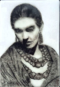 Portrait of a woman wearing multiple necklaces.