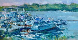 Boats docked by a serene riverside.