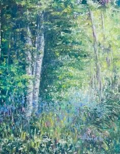 Forest scene with trees and wildflowers.